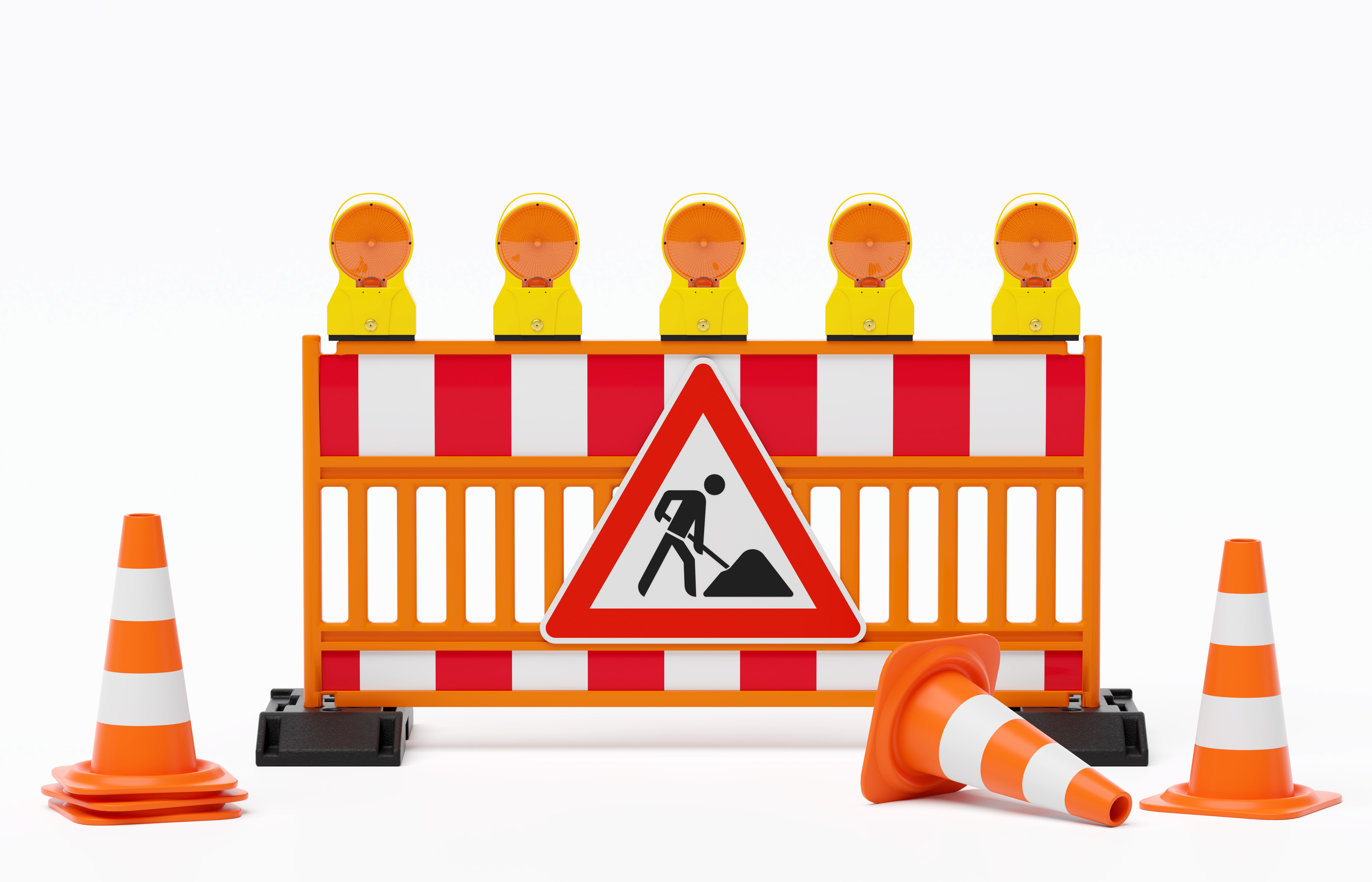 Baustellenabsperrung mit rot-weißen Balken, Warnleuchten und Verkehrshütchen.